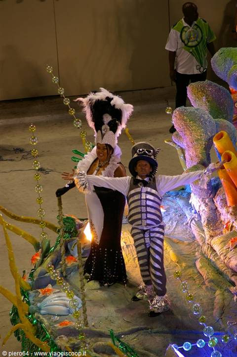 Dancers in feather and silver skeleton costumes on Rio carnival float