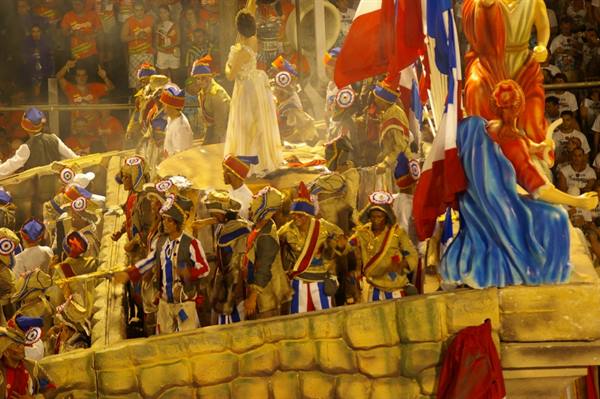 Carnival float with costumed dancers and performers at Rio's sambodrome