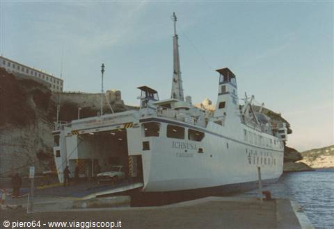 Ichnusa ferry docked at harbor with ramp and car