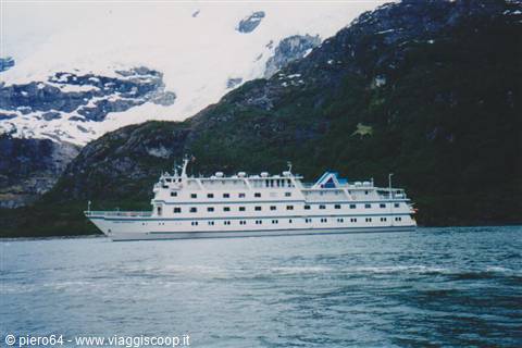 White cruise ship sailing in front of snowy mountains, Glacier Bay