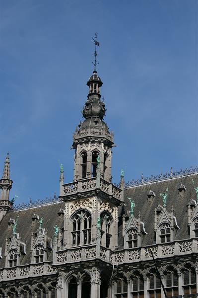 Gothic spire of the Maison du Roi on Brussels' Grand-Place against a blue sky