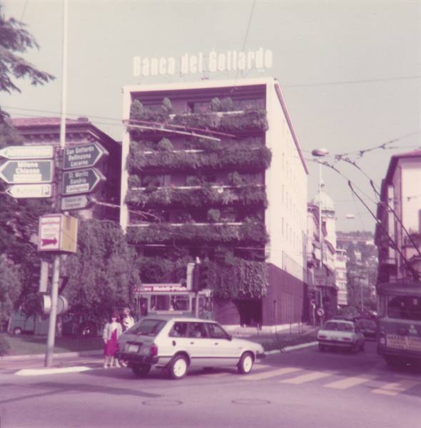Banca del Gottardo building in Locarno, vintage car and street signs