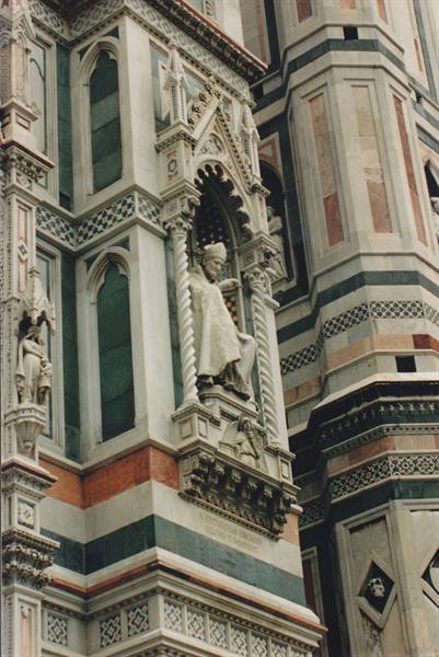 Marble pope statue in a niche of Florence Cathedral
