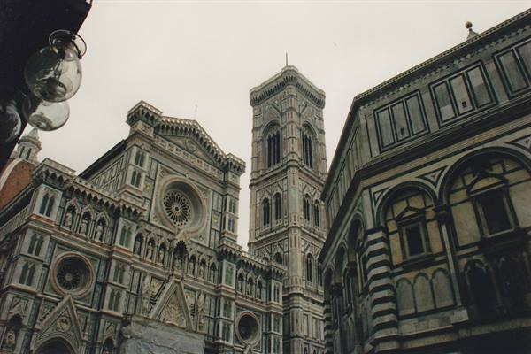 Florence Cathedral with Giotto's bell tower and the baptistery under a grey sky