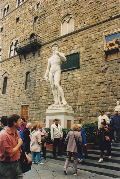Copy of Michelangelo's David in front of Palazzo Vecchio, tourists admiring