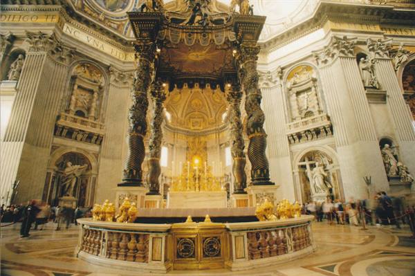 Bernini's bronze baldachin under St. Peter's dome, visitors around the altar