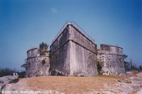 Stone walls of Fort Charlotte in Nassau under a clear blue sky