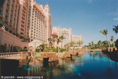 Atlantis resort at Paradise Island, pink towers above the pool with palm trees