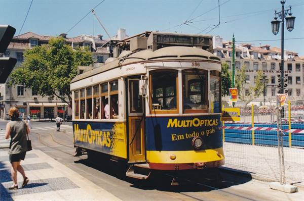 Yellow and blue tram 12 at Praça Luís de Camões, Lisbon