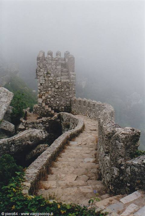 Stone staircase of the Moorish Castle in Sintra shrouded in fog