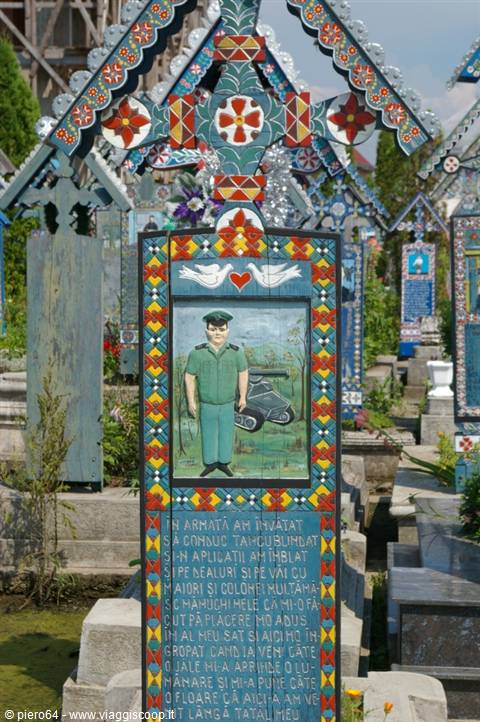 Merry Cemetery of Săpânța: painted wooden cross with soldier and doves