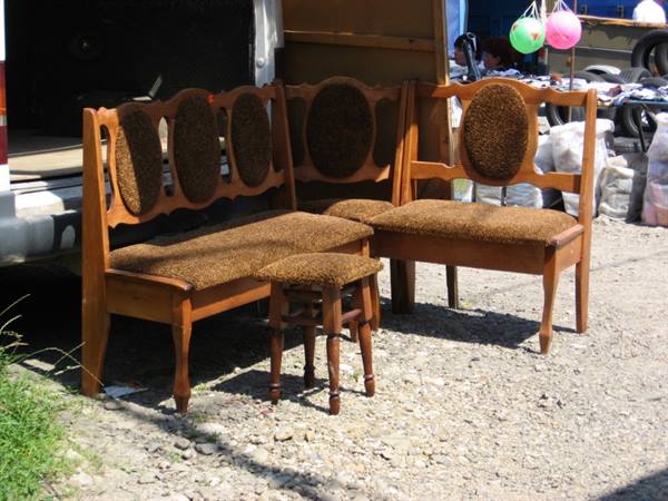 Wooden benches with brown fabric and a stool for sale at a flea market