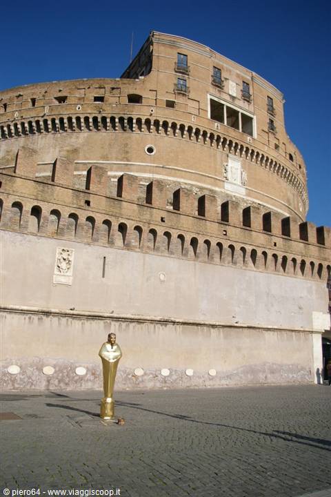 Castel Sant'Angelo in Rome, travertine walls, golden statue on cobblestones