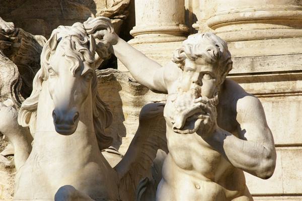 Marble triton blowing a shell beside a horse, Trevi Fountain, Rome