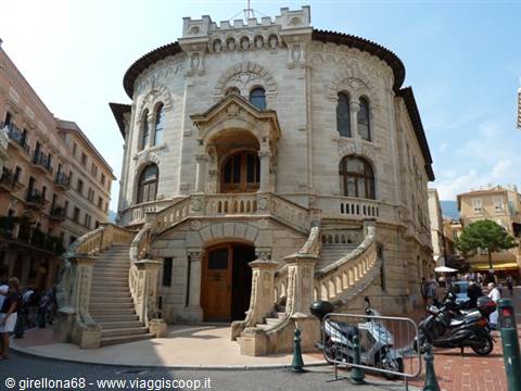 Monaco courthouse, light stone facade with twin staircases and parked scooters