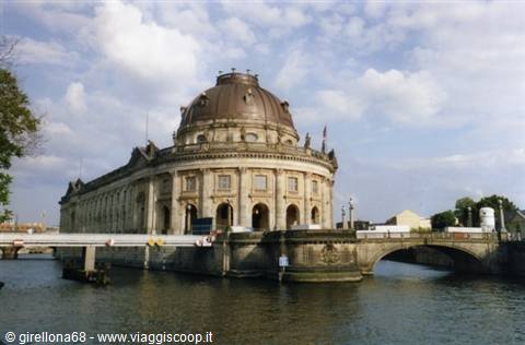Bode Museum with stone dome on the Spree river in Berlin