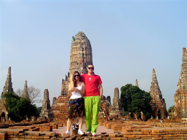 Couple in front of brick prangs at Wat Chaiwatthanaram, Ayutthaya