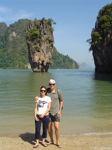 Couple on the beach in front of Ko Tapu, Phang Nga Bay