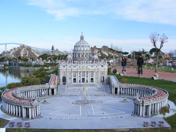 Scale model of St. Peter's Basilica and Bernini's colonnade, visitors walking nearby