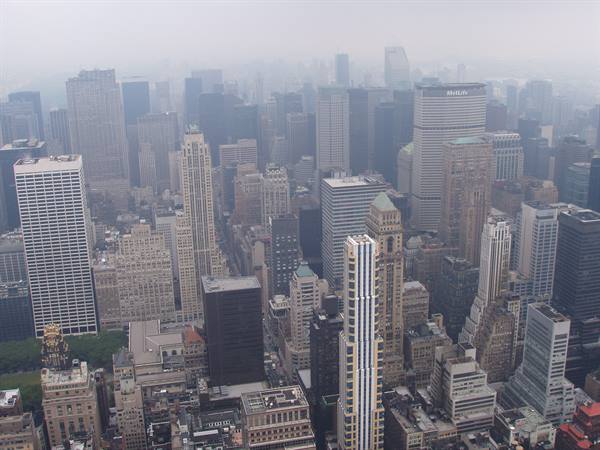 Manhattan skyscrapers in the fog, seen from above under grey diffuse light