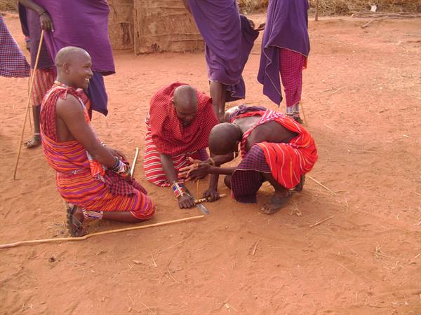 Masai lighting the fire