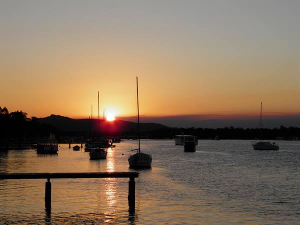 Sailboats moored at dawn in Noosa harbor