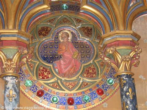 Painted quatrefoil medallion of a saint beneath gilded vaults, Sainte-Chapelle