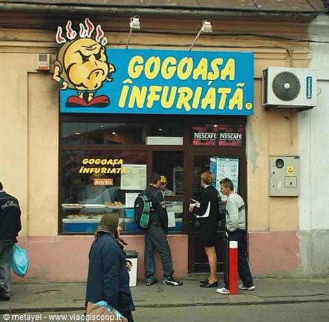 People queueing outside the Gogoasa Infuliata pastry shop on the street