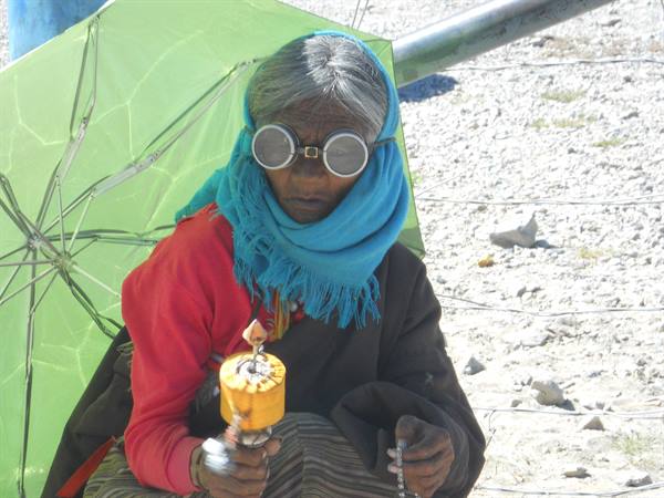 elderly woman in prayer