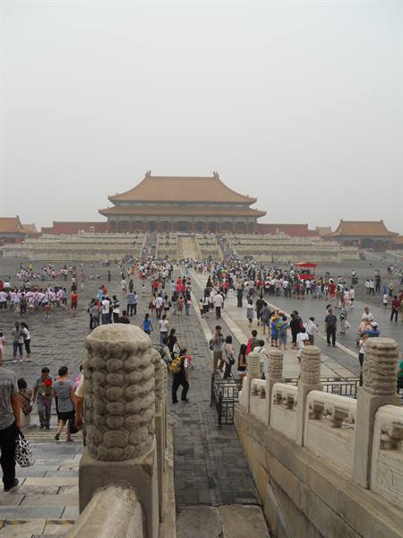 Crowds under a grey sky in front of the Forbidden City palace, Beijing