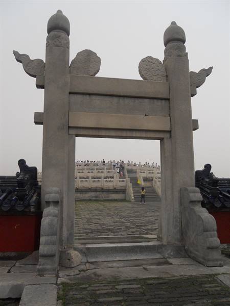 Carved stone gate at the Temple of Heaven, visitors beyond
