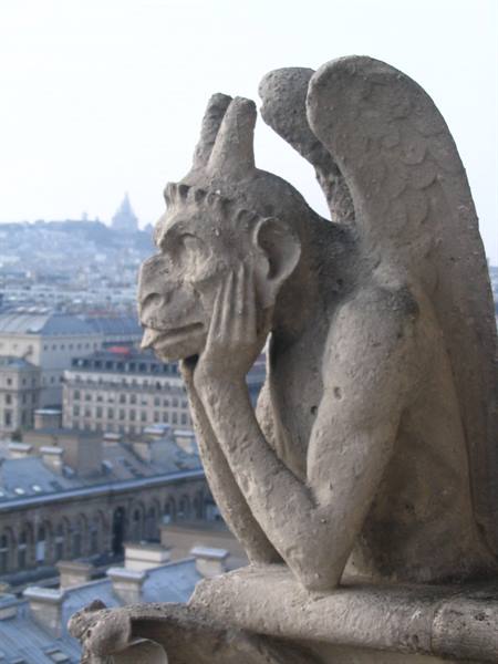 Pensive Notre-Dame gargoyle overlooking Paris rooftops, Sacré-Cœur visible in the distance