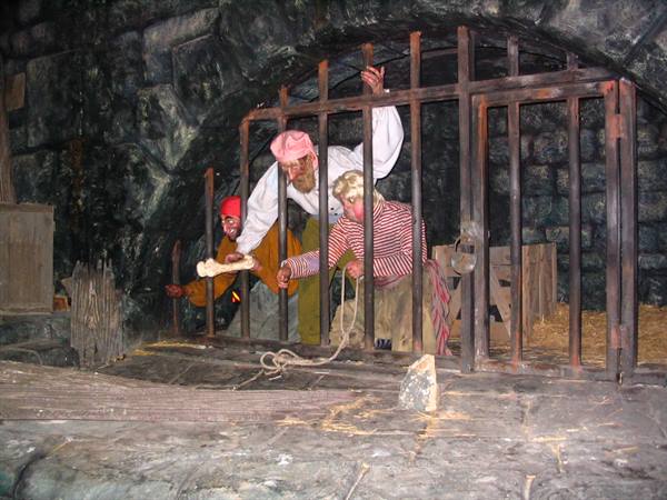 Actors dressed as pirates in a themed dungeon scene