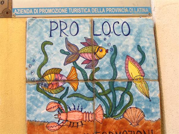 Painted ceramic sign with fish and lobster, Pro Loco tourist office in Latina