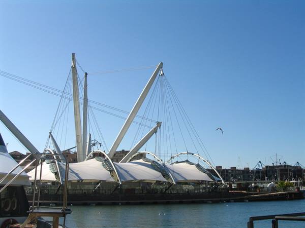 Renzo Piano's Bigo with white sails and steel masts, Genoa's Porto Antico