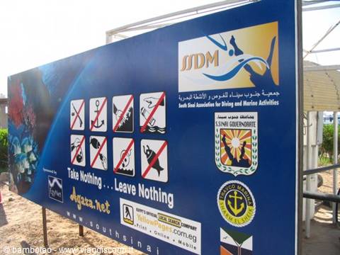 Blue sign in South Sinai with diving prohibition icons: Take Nothing, Leave Nothing