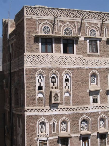 Brick tower house with white gypsum arched windows, Sana'a