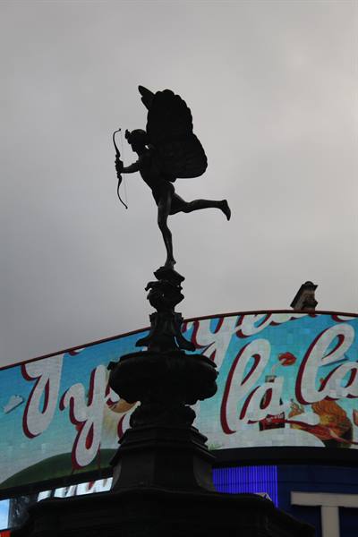 Eros statue with bow and wings above the fountain at Piccadilly Circus, London