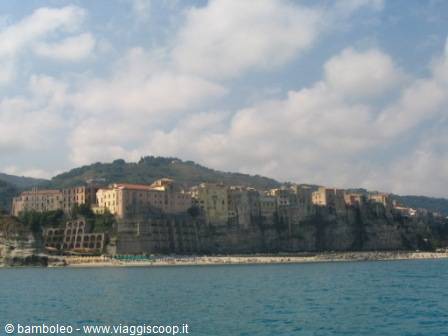 Tropea, colorful houses on the cliff above turquoise sea