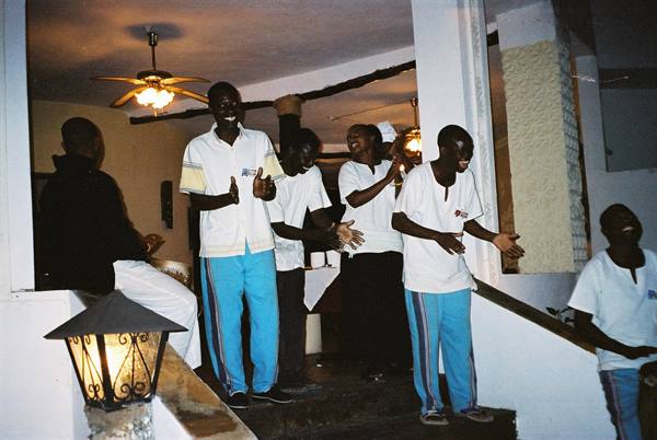 waiters of our residence singing
