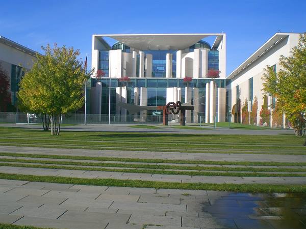 Berlin Chancellery, glass and white concrete facade, lawn and sculptures