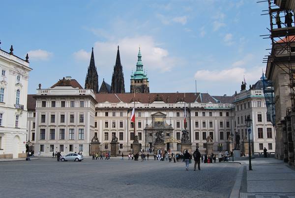 Tourists at Prague Castle square with St Vitus Cathedral spires