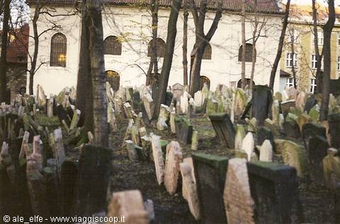 Prague Old Jewish Cemetery, weathered tombstones crowded among bare trees