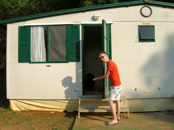 one of my two travel companions in front of our little house