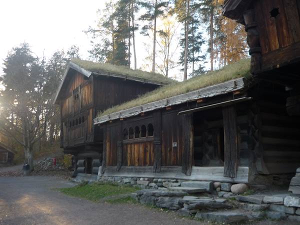 Wooden houses with turf roofs at Bygdøy open-air museum, Oslo