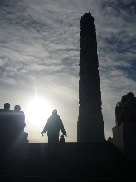 Silhouettes before the Vigeland Monolith in Frogner Park, Oslo