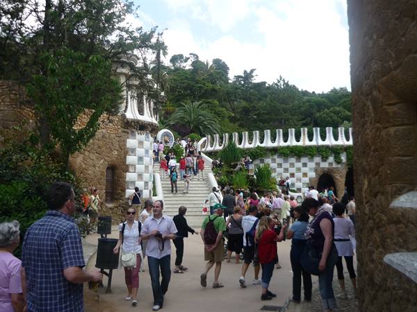 Tourists on the mosaic-decorated staircase at Park Güell, Barcelona