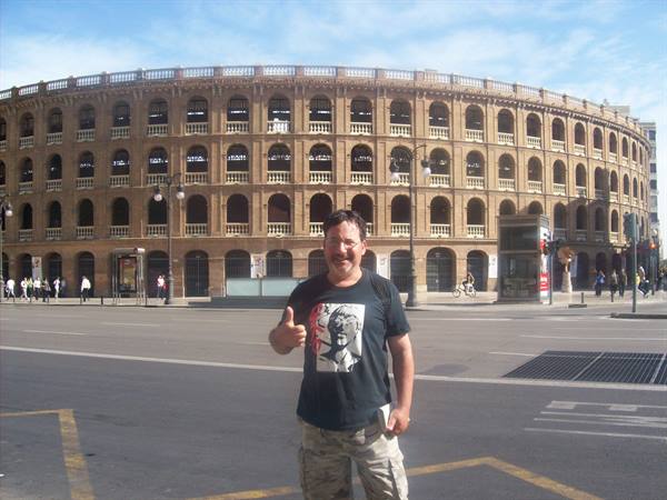 Man giving thumbs up in front of Valencia's Plaza de Toros arena