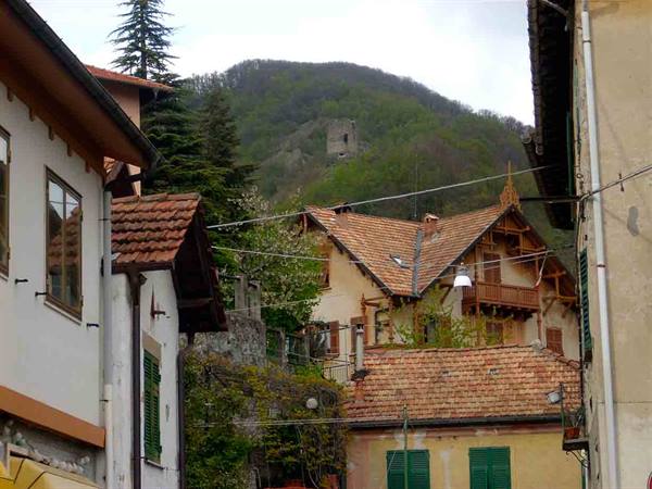 The ancient tower peeking between the houses