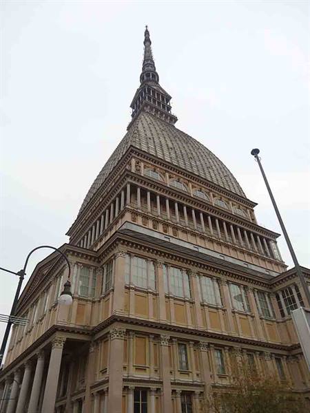 The Mole Antonelliana in Turin rises against a grey sky